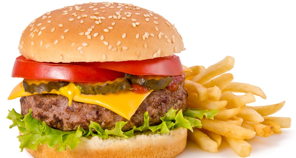 Cheeseburger with lettuce, tomato, pickles and fries